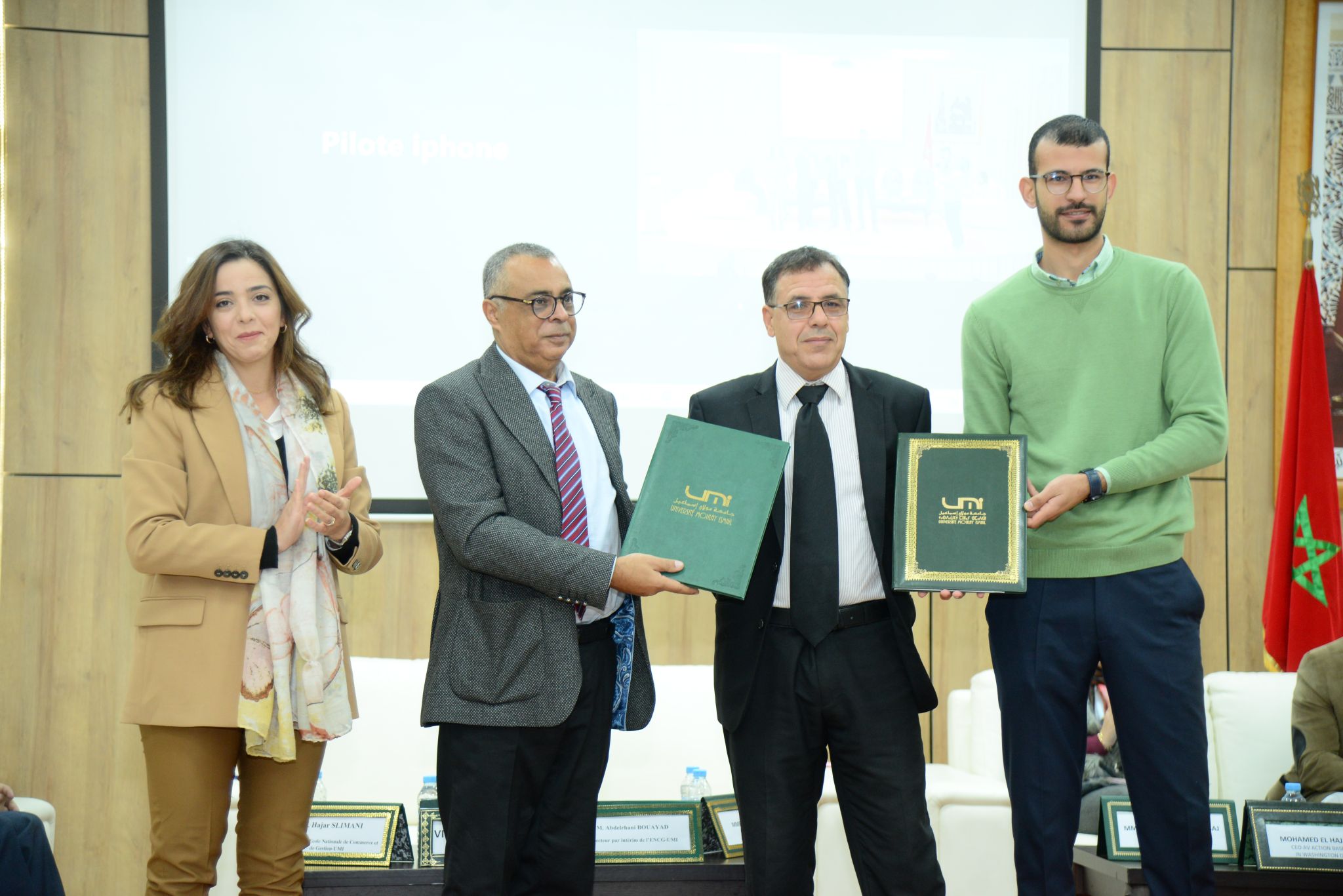 The Dean of ENCG Meknès signing a partnership agreement during an official collaboration event.